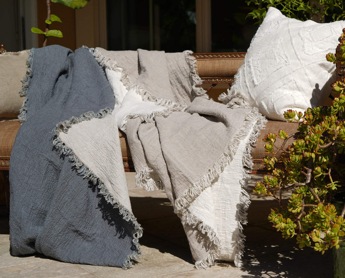 a abbey throw blanket on a bench